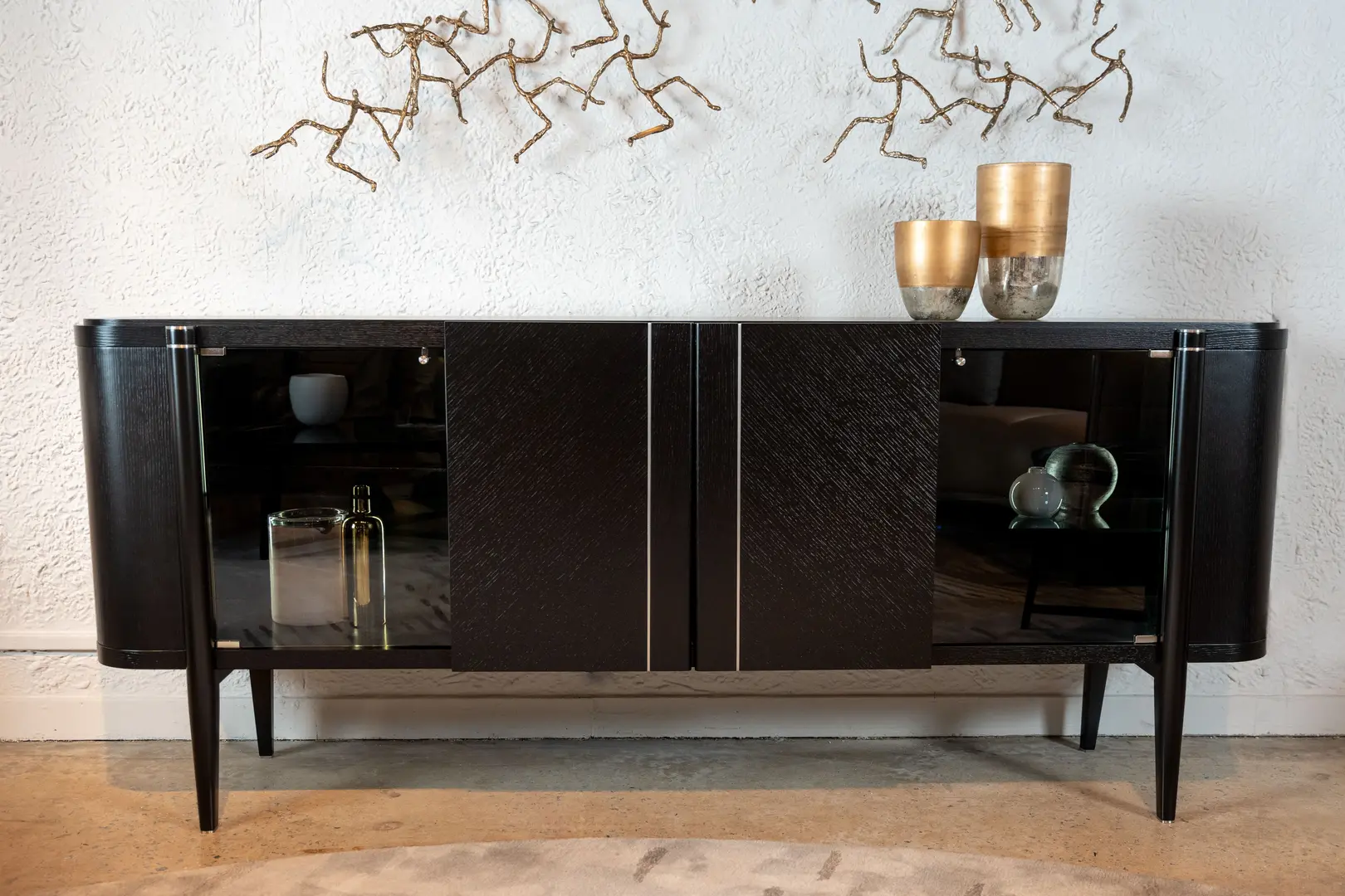 A picture of a modern walnut sideboard on a white background