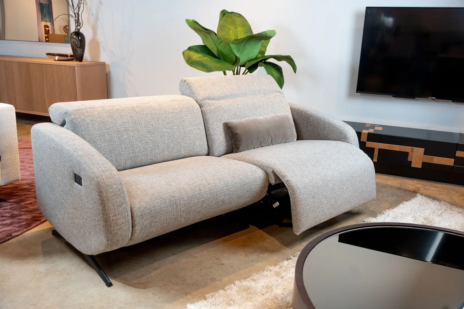 A picture of an elegant eggshell-white sofa in a modern living room